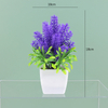 Potted bloom: 12cm Mini Artificial Orchid-Style Flower Potted Plant in Striped Pot
