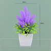 Potted bloom: 12cm Mini Artificial Orchid-Style Flower Potted Plant in Striped Pot