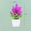 Potted bloom: 12cm Mini Artificial Orchid-Style Flower Potted Plant in Striped Pot